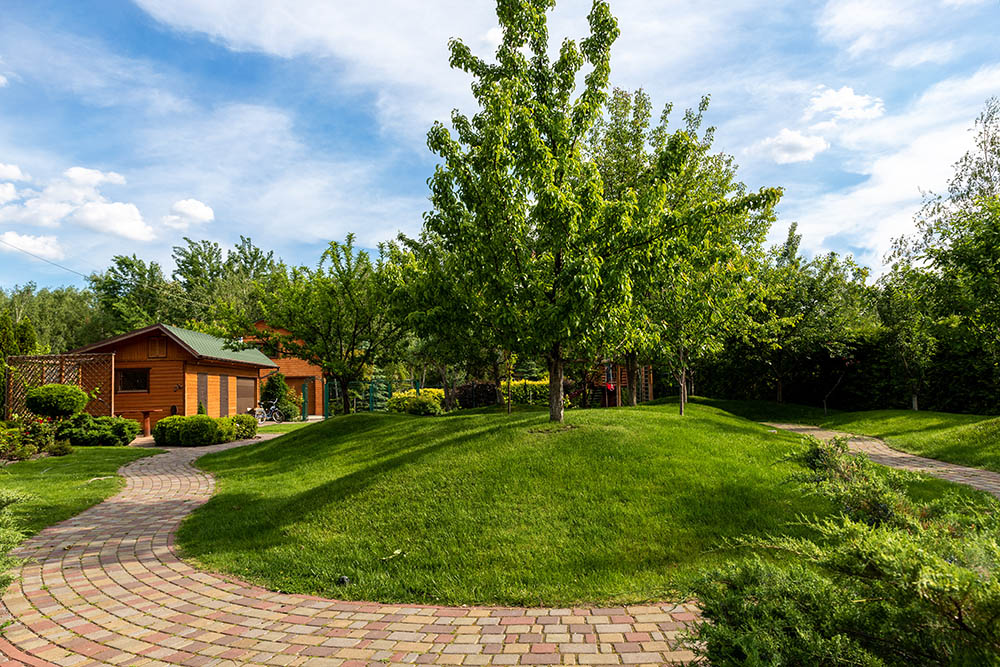 A beautiful shot of landscaped property with Hot Shot Sprinkler Repair & Landscape - Farmington