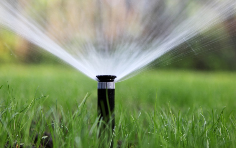 An image of a sprinkler doing its job - contact Hot Shot Sprinkler Repair & Landscape for sprinkler services in Utah.